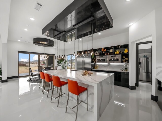 7604 Nocona Dr, Parker, TX 75098 - kitchen featuring high end refrigerator, stainless steel refrigerator with ice dispenser, a high ceiling, healthy amount of natural light, and recessed lighting