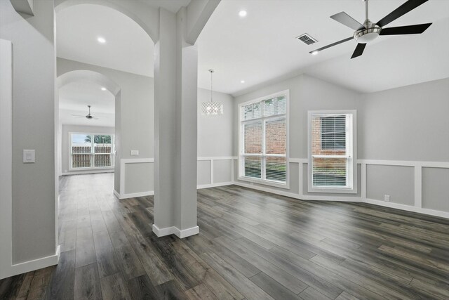 2528 Forestwood Dr, Flower Mound, TX 75028 - unfurnished living room with a ceiling fan, arched walkways, healthy amount of natural light, dark wood-style flooring, and recessed lighting