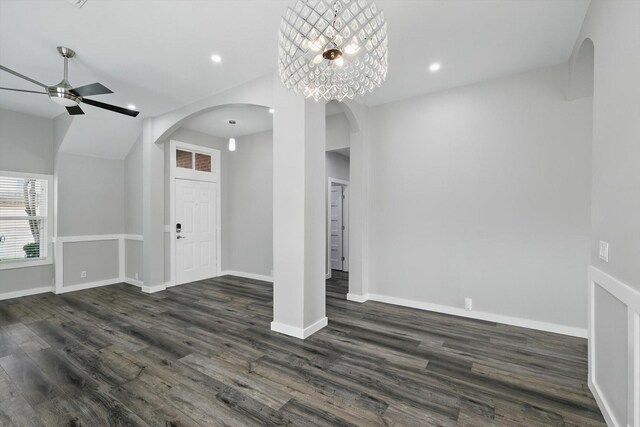 2528 Forestwood Dr, Flower Mound, TX 75028 - unfurnished living room featuring a ceiling fan, arched walkways, dark wood-style flooring, and recessed lighting