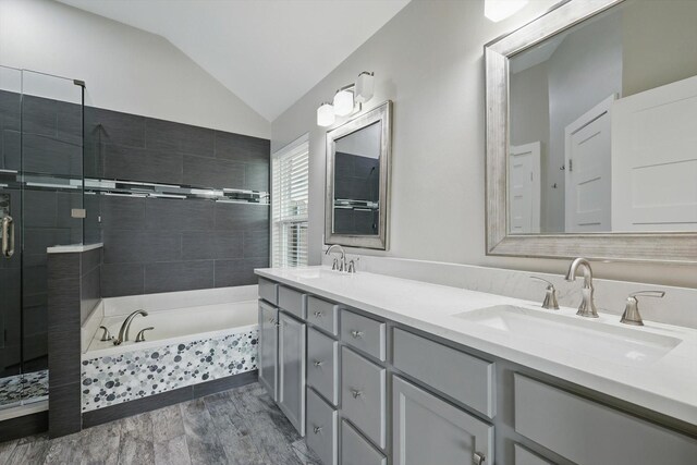 2528 Forestwood Dr, Flower Mound, TX 75028 - bathroom featuring vaulted ceiling, double vanity, a bath, and a stall shower