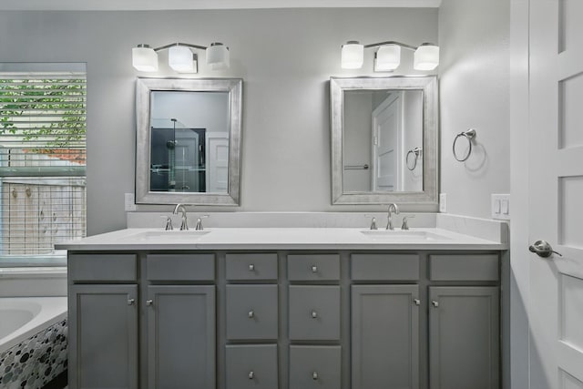 2528 Forestwood Dr, Flower Mound, TX 75028 - bathroom featuring double vanity and a bathtub