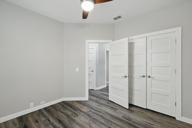 2528 Forestwood Dr, Flower Mound, TX 75028 - unfurnished bedroom featuring dark wood-style flooring, a closet, and a ceiling fan