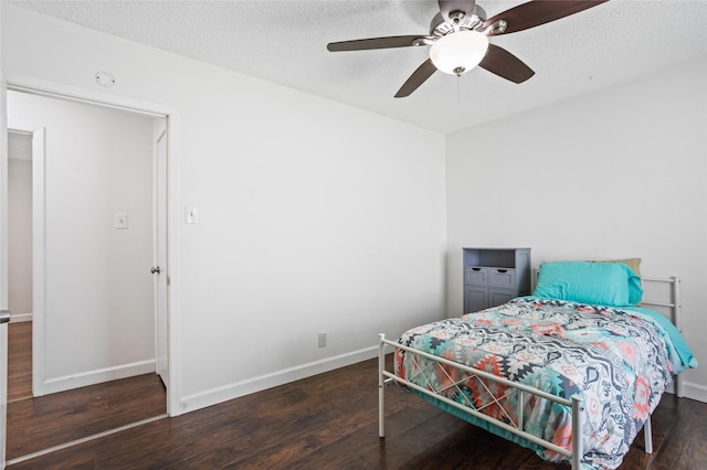 814 S Western Hills Dr, Howe, TX 75459 - bedroom with wood finished floors, ceiling fan, and a textured ceiling