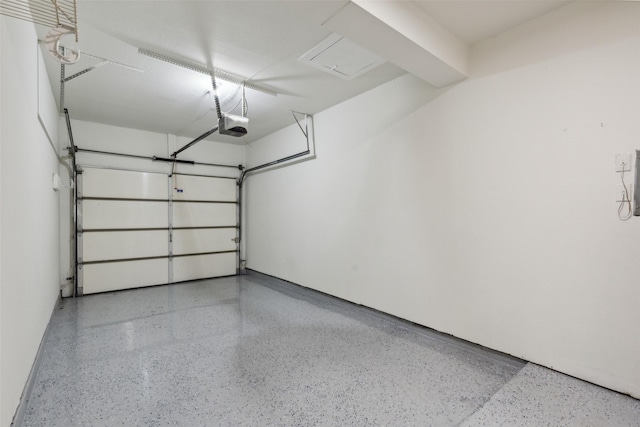 7340 Skillman St Unit 107, Dallas, TX 75231 - garage featuring a garage door opener