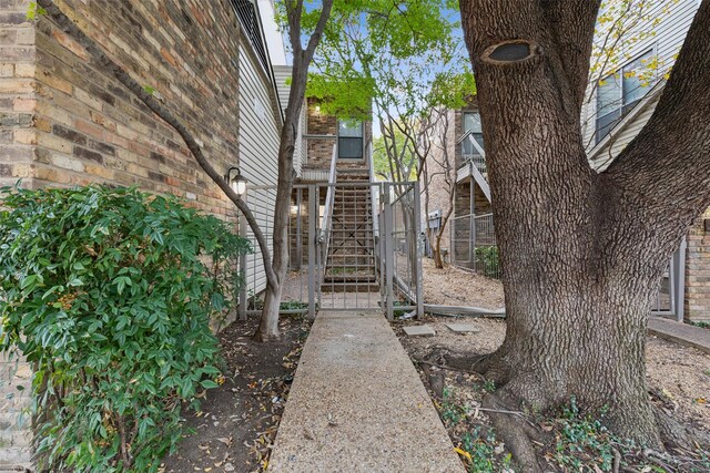 7340 Skillman St Unit 107, Dallas, TX 75231 - garage featuring a garage door opener