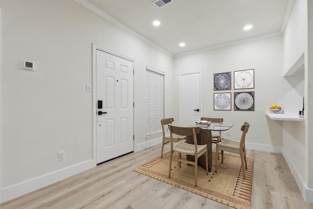 7340 Skillman St Unit 107, Dallas, TX 75231 - dining space featuring ornamental molding, light wood-type flooring, and recessed lighting