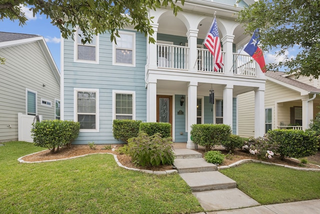 1017 Appalachian Ln, Savannah, TX 76227 - view of front facade with a balcony, covered porch, and a front lawn