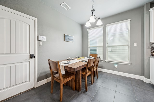 1017 Appalachian Ln, Savannah, TX 76227 - dining space with dark tile patterned flooring and a chandelier