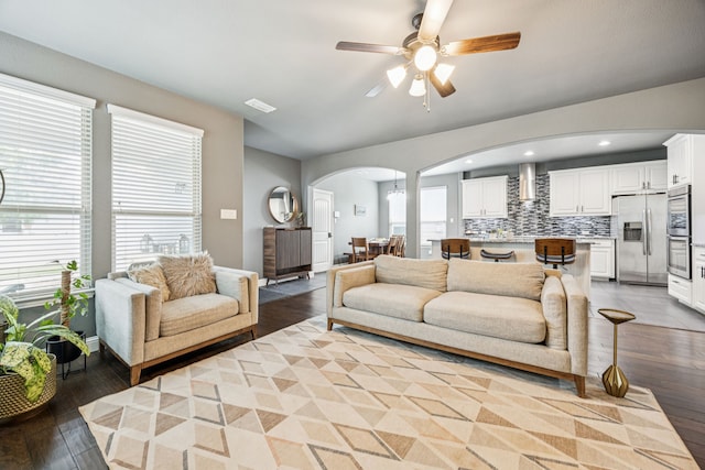 1017 Appalachian Ln, Savannah, TX 76227 - living area with arched walkways, ceiling fan, light wood-style flooring, healthy amount of natural light, and recessed lighting