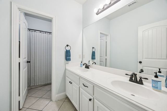 1017 Appalachian Ln, Savannah, TX 76227 - bathroom featuring double vanity and tile patterned flooring