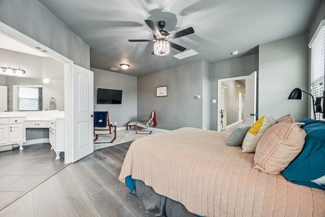 1017 Appalachian Ln, Savannah, TX 76227 - bedroom with a desk, wood finished floors, ceiling fan, and ensuite bath