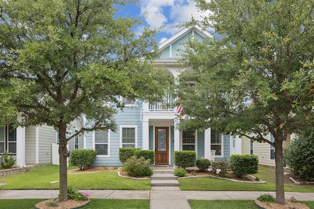 1017 Appalachian Ln, Savannah, TX 76227 - obstructed view of property with a front yard and a balcony