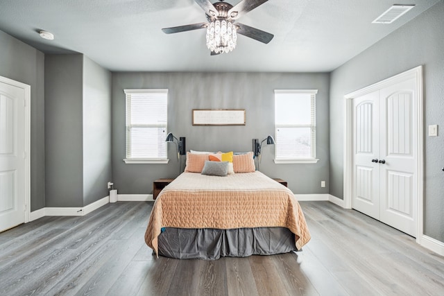 1017 Appalachian Ln, Savannah, TX 76227 - bedroom with wood finished floors, ceiling fan, and a closet