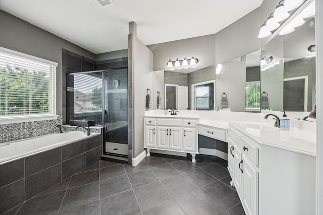 1017 Appalachian Ln, Savannah, TX 76227 - bathroom with double vanity, a stall shower, tile patterned floors, and a garden tub