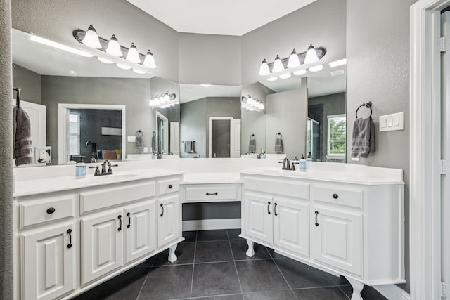1017 Appalachian Ln, Savannah, TX 76227 - full bath with tile patterned floors, double vanity, and an enclosed shower