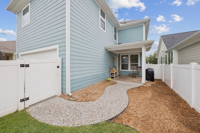 1017 Appalachian Ln, Savannah, TX 76227 - rear view of property featuring a gate, a fenced backyard, and a patio area