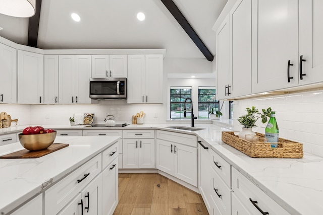 810 Quail Run, Keller, TX 76248 - kitchen featuring stainless steel microwave, backsplash, white cabinetry, and recessed lighting