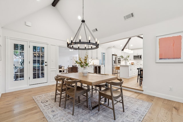 810 Quail Run, Keller, TX 76248 - dining space with a chandelier, beverage cooler, high vaulted ceiling, recessed lighting, and light wood finished floors