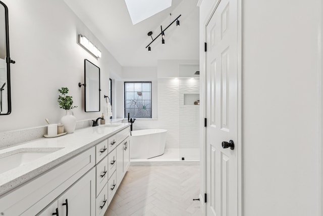 810 Quail Run, Keller, TX 76248 - full bathroom featuring a skylight, double vanity, a freestanding tub, and plenty of natural light