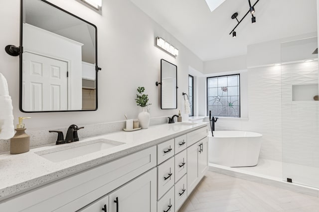 810 Quail Run, Keller, TX 76248 - bathroom featuring double vanity, a freestanding bath, tiled shower, and a skylight
