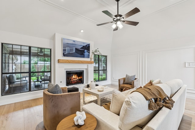 810 Quail Run, Keller, TX 76248 - living area with light wood finished floors, a lit fireplace, a ceiling fan, crown molding, and recessed lighting