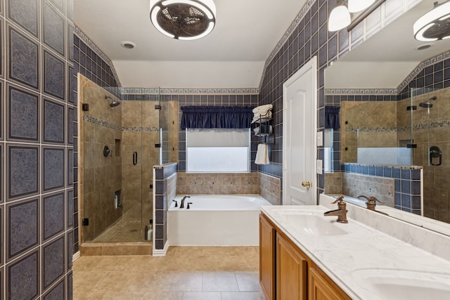 495 Bending Oaks Trl, Rockwall, TX 75087 - bathroom featuring a shower stall, a garden tub, tile patterned floors, and double vanity
