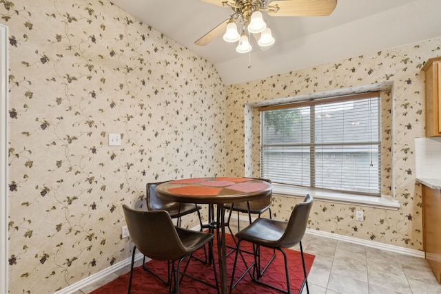 495 Bending Oaks Trl, Rockwall, TX 75087 - dining area featuring wallpapered walls, vaulted ceiling, ceiling fan, and light tile patterned flooring