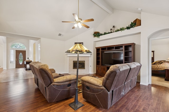 495 Bending Oaks Trl, Rockwall, TX 75087 - living area with a ceiling fan, a tile fireplace, high vaulted ceiling, beamed ceiling, and wood finished floors