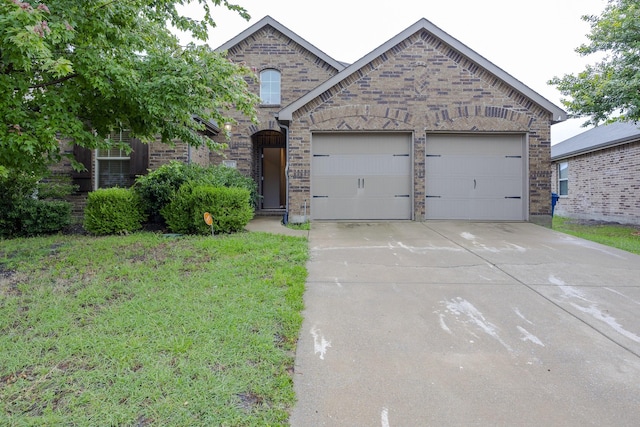 2111 Rains County Rd, Forney, TX 75126 - view of front of property with an attached garage, driveway, brick siding, and a front lawn