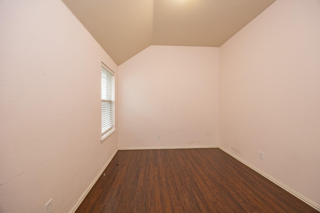 2111 Rains County Rd, Forney, TX 75126 - spare room featuring wood finished floors and vaulted ceiling