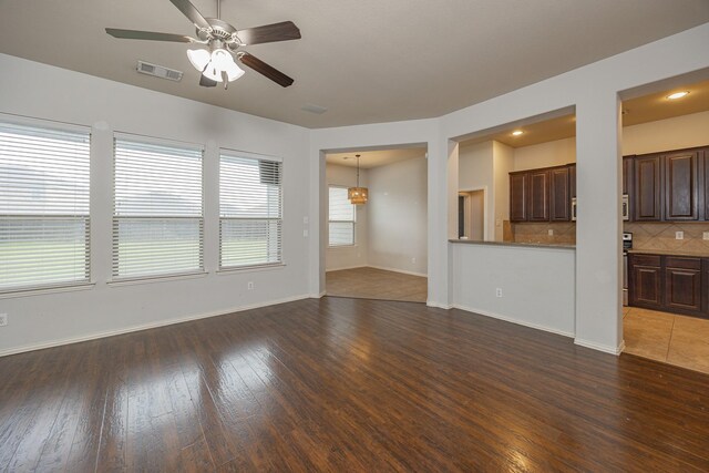 2111 Rains County Rd, Forney, TX 75126 - unfurnished living room with a ceiling fan and hardwood / wood-style floors