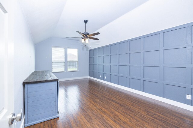 2111 Rains County Rd, Forney, TX 75126 - unfurnished living room with a decorative wall, a ceiling fan, lofted ceiling, and dark wood-style floors