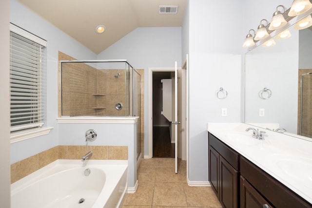 2111 Rains County Rd, Forney, TX 75126 - full bath featuring a garden tub, a stall shower, double vanity, tile patterned flooring, and vaulted ceiling
