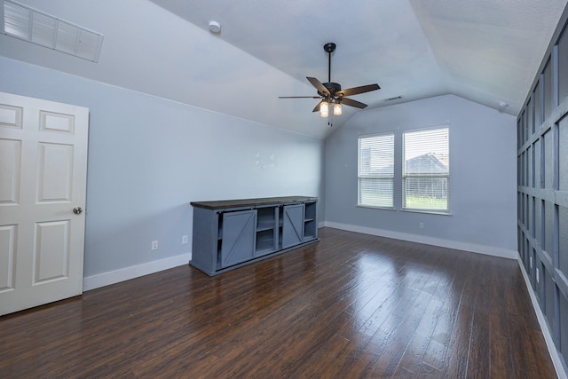 2111 Rains County Rd, Forney, TX 75126 - unfurnished living room with a ceiling fan, dark wood-style floors, and vaulted ceiling