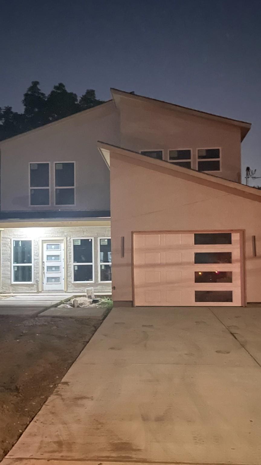 2417 Felton Ct, Dallas, TX 75215 - view of front of home featuring concrete driveway and stucco siding