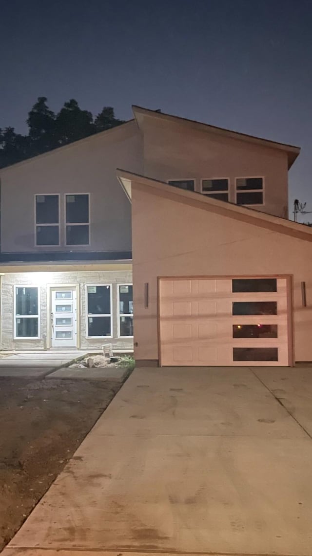 2417 Felton Ct, Dallas, TX 75215 - view of front of home featuring concrete driveway and stucco siding