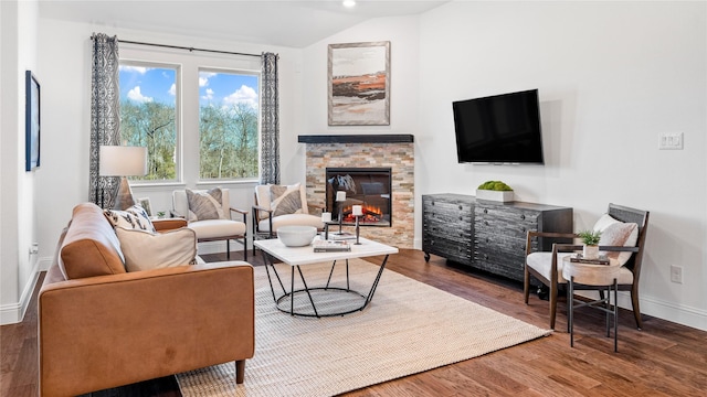 2015 Partridge Rd, Princeton, TX 75407 - living room featuring vaulted ceiling, a stone fireplace, and wood finished floors