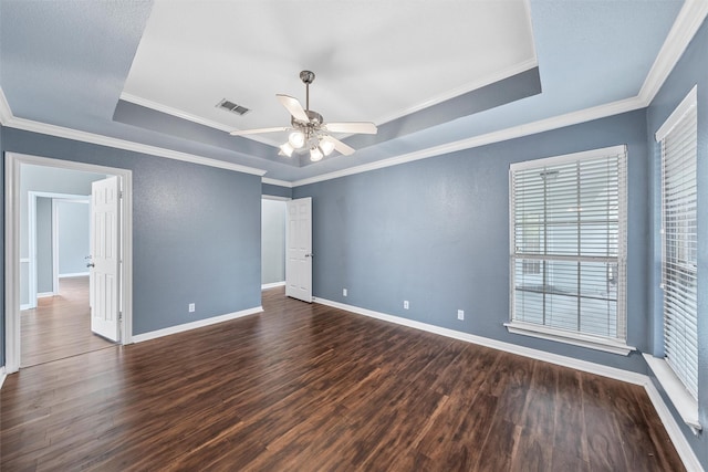 519 Kristi St, Robinson, TX 76706 - unfurnished room with a tray ceiling, dark wood-style floors, a ceiling fan, and crown molding
