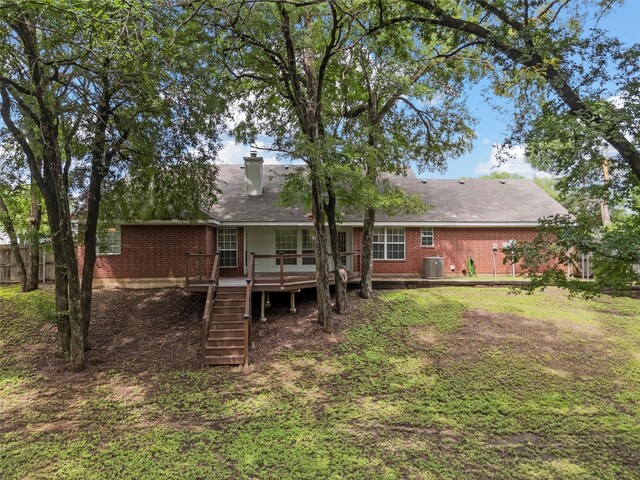 519 Kristi St, Robinson, TX 76706 - back of house featuring a wooden deck, brick siding, stairway, and a chimney