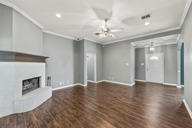 519 Kristi St, Robinson, TX 76706 - unfurnished living room with a ceiling fan, wood finished floors, a brick fireplace, recessed lighting, and arched walkways
