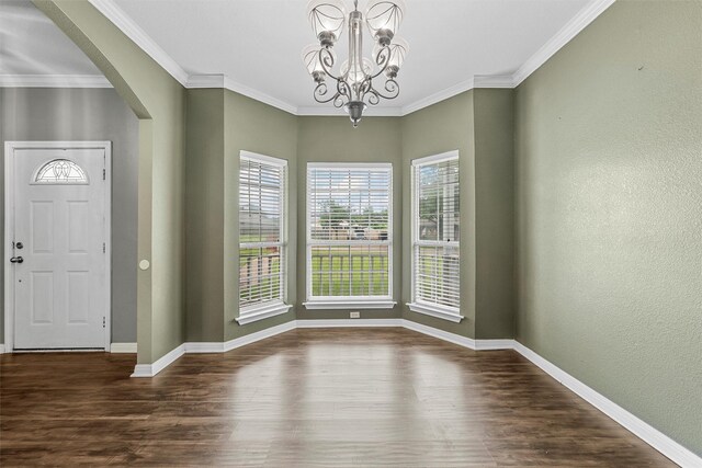 519 Kristi St, Robinson, TX 76706 - entryway featuring arched walkways, wood finished floors, a chandelier, and ornamental molding