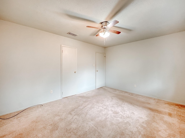 220 Hampton Ave, Corsicana, TX 75110 - unfurnished bedroom featuring carpet floors and a ceiling fan