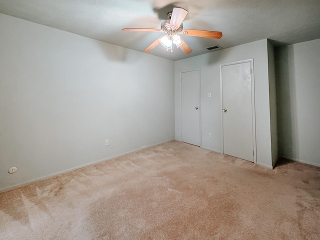 220 Hampton Ave, Corsicana, TX 75110 - unfurnished bedroom featuring light colored carpet and a ceiling fan