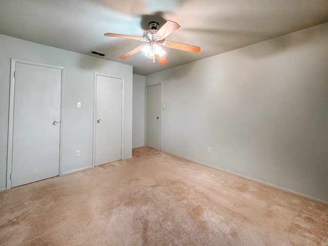 220 Hampton Ave, Corsicana, TX 75110 - unfurnished bedroom with light carpet and ceiling fan