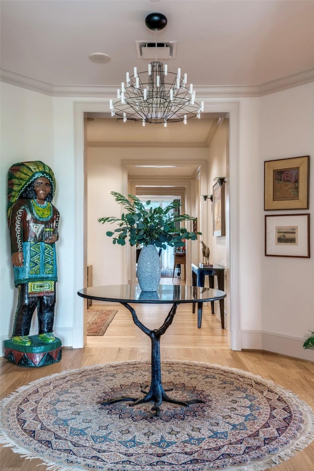 3505 Turtle Creek Blvd Unit 2A, Dallas, TX 75219 - hall with a chandelier, ornamental molding, and wood finished floors