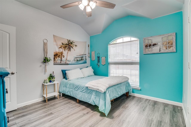 1237 Bay Line Dr, Rockwall, TX 75087 - bedroom with wood finished floors, lofted ceiling, and ceiling fan