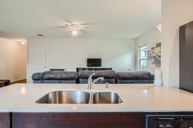 9263 Summerlee St, Dallas, TX 75227 - kitchen featuring open floor plan, dark brown cabinetry, a ceiling fan, and light stone countertops