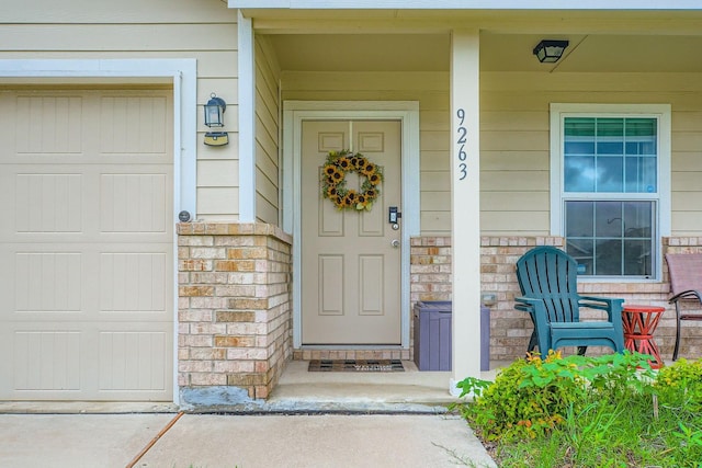 9263 Summerlee St, Dallas, TX 75227 - view of exterior entry featuring covered porch and stone siding