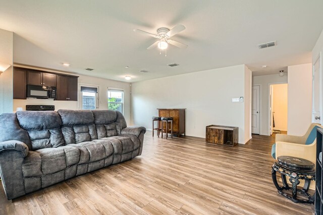 9263 Summerlee St, Dallas, TX 75227 - living area with a ceiling fan and light wood-type flooring