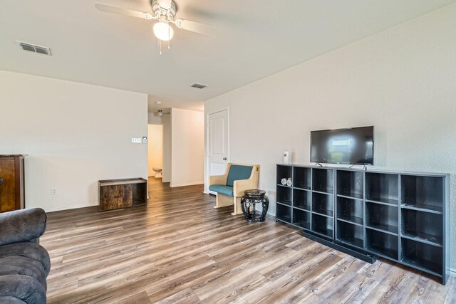 9263 Summerlee St, Dallas, TX 75227 - unfurnished living room with wood finished floors and a ceiling fan